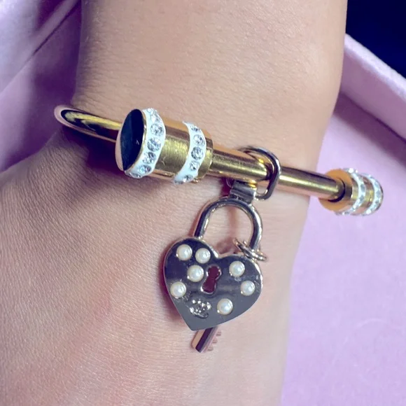 CHANEL heart and lock authentic charm on gold plated bracelet